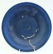 A CHINESE BLUE GLAZE PORCELAIN DISH, 28.5cm diameter.