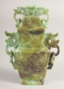 A CHINESE MULTI-COLOURED URN SHAPED VASE AND COVER with ring handles. 8
