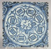 A CHINESE BLUE AND WHITE GLAZED TEMPLE TILE. 19.5cm square