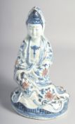 A CHINESE BLUE, WHITE, AND UNDERGLAZE RED PORCELAIN FIGURE OF GUANYIN. 28.5cm high