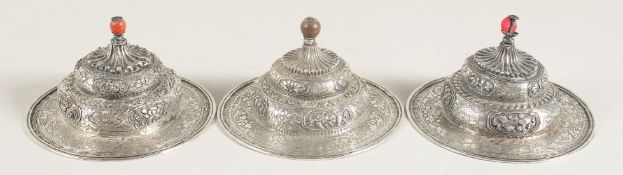 A SET OF THREE CHINESE SILVER CIRCULAR LIDS, 10.5cm diameter, (3).