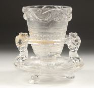 A CHINESE CUT GLASS LIBATION CUP AND STAND. 8.5cm overall