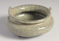 A CHINESE CRACKLE GLAZE TWIN HANDLE TRIPOD CENSER, 12.5cm diameter.