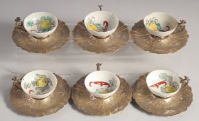SIX CHINESE PORCELAIN CUPS WITH TURKISH OTTOMAN SILVER SAUCERS and mounted handles, porcelain cup