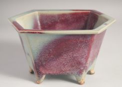 A CHINESE JUN WARE PLANT POT, raised on six feet, 25cm wide.