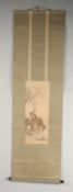 A JAPANESE HANGING SCROLL PAINTING ON SILK, depicting a monkey upon a stag in a woodland scene,