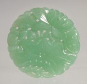 A SMALL CHINESE CARVED AND PIERCED JADE PENDANT, 3cm.