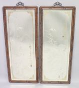 A LARGE PAIR OF CHINESE CARVED HARDWOOD FRAMED MIRRORS, the glass with engraved decoration depicting