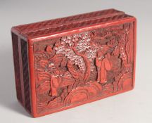 A CHINESE CINNABAR LACQUER RECTANGULAR BOX, the lid decorated with figures in an outdoor setting,