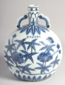 A CHINESE BLUE AND WHITE PORCELAIN TWIN HANDLE MOON FLASK, decorated with flora and bearing a six-