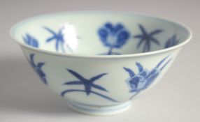 A CHINESE BLUE AND WHITE PORCELAIN BOWL, decorated with large flower heads, 15cm diameter.