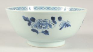 AN 18TH CENTURY CHINESE QIANLONG PERIOD BLUE AND WHITE PORCELAIN BOWL, painted with flora, 18.5cm