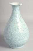 A CHINESE POWDER BLUE GLAZE YUHUCHUNPING VASE carved with flower heads and scrolling vine, the