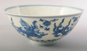 A CHINESE BLUE AND WHITE PORCELAIN BOWL, painted with mythological beasts and intertwined pattern,