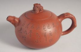 A CHINESE YIXING TEAPOT; signed by Gu Jing Zhou, 16cm spout to handle.