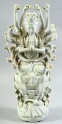 A DEHUA PORCELAIN MULTI ARMED FIGURE OF DOUMU, seated in dhyanasana upon a lotus throne, 40.5cm