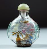 A SUPERB CHINESE ROCK CRYSTAL SNUFF BOTTLE AND JADE STOPPER, with carved and stained decoration