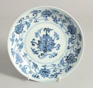A CHINESE BLUE AND WHITE PORCELAIN DISH painted with lotus and vine, with six-character mark to