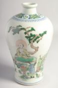 A CHINESE FAMILLE VERTE PORCELAIN VASE, decorated with seated immortals, six-character mark to base,