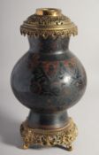 A JAPANESE BLACK GROUND CLOISONNE VASE / LAMP, with pierced metal mounts, decorated with flower head