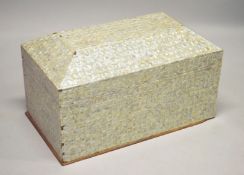 A LARGE INDIAN MOTHER OF PEARL VENEERED SARCOPHAGUS SHAPED COFFER, the hinged cover revealing a