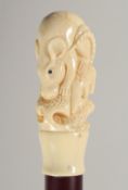 A CARVED BONE HANDLE WALKING STICK 