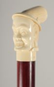 A CARVED BONE HANDLE WALKING STICK 