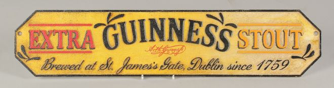 A CAST IRON `GUINNESS' SIGN. 4.5ins x 22ins.