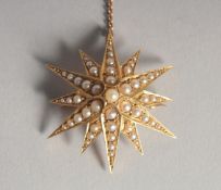 A 15CT GOLD SEED PEARL STAR BROOCH.