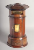 A GOOD GEORGIAN STYLE MAHOGANY CIRCULAR POST BOX with letter flap, door and single drawer. 16ins