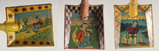 THREE TIN LITHOGRAPH TOY SPADES.