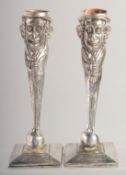 A PAIR OF JUDAICA STANDING MEN CANDLESTICKS on square bases 
