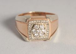 A GENTLEMAN'S 18CT GOLD AND DIAMOND SET SQUARE RING, stamped .750.