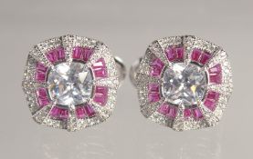 A PAIR OF SILVER ART DECO DESIGN EARRINGS.