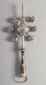 A .925 SILVER RATTLE with wooden handle. 8ins long.