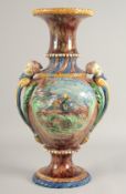 A GOOD LALIQUE MAJOLICA POTTERY TWO HANDLED URN with blue speckled decoration, mask handles and