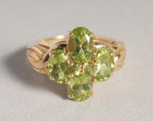A 10CT GOLD PERIDOT RING.