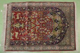 A PERSIAN ANIMAL AND FLORAL RUG. 4ft X 2ft 10ins