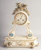 A 19TH CENTURY FRENCH ALABASTER CLOCK with drum movement, the case edged in gilt with oval enamel