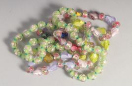 TWO STRINGS OF MILLEFIORI GLASS BEADS.