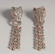A PAIR OF SILVER RUBY SET PANTHER DROP EARRINGS.
