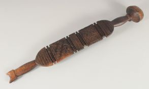 A SOUTH SEAS CARVED CLUB OR PADDLE. 2ft 3ins long.