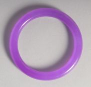 A GOOD LAVENDER JADE BANGLE. 3ins diameter.