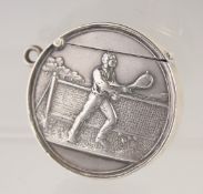 A RARE EDWARD VII SILVER CIRCULAR VESTA, the front with a tennis player in relief. 1.5ins
