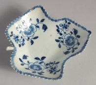 A LIVERPOOL LEAF SHAPED DISH painted in blue with three flower sprays, probably Christians'
