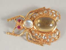 A GOOD GOLD BUG BROOCH set with moonstone, sapphires and diamonds.