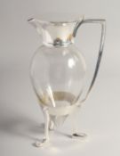 A CHRISTOPHER DRESSER DESIGN SILVER PLATED JUG on crow's feet.