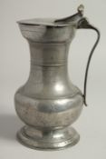A GOOD 18TH CENTURY SWISS PEWTER FLAGON AND COVER. 10ins high.