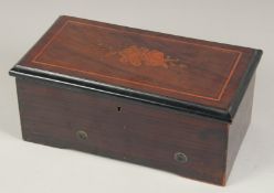 A SMALL 19TH CENTURY SWISS MUSICAL BOX the top with floral inlay. 11.5ins long.