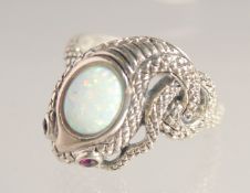A SILVER RUBY EYE AND GILSON OPAL SNAKE RING.